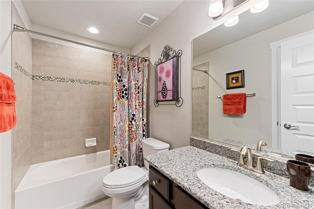 full bathroom with shower / tub combo with curtain, vanity, and toilet