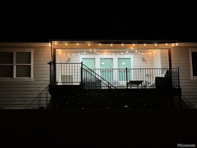 view of back house at twilight