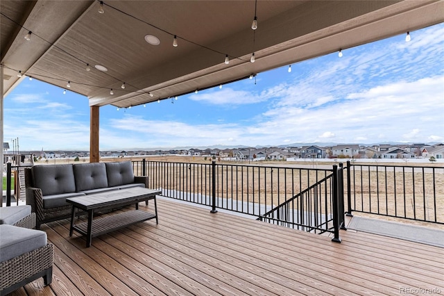 wooden deck with an outdoor hangout area