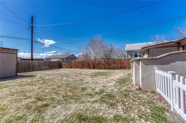 view of yard featuring a fenced backyard