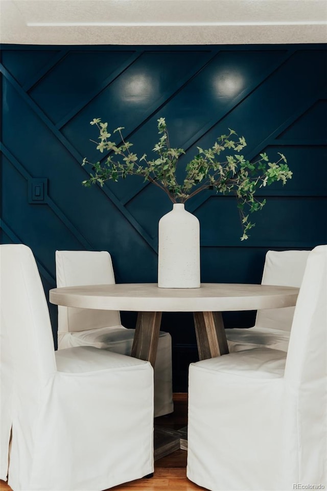 dining space featuring wood finished floors