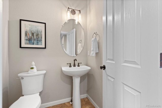 bathroom featuring tile patterned floors, sink, and toilet