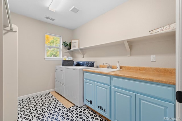 laundry room featuring sink, separate washer and dryer, and cabinets