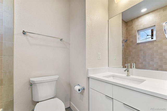 full bathroom featuring vanity and toilet