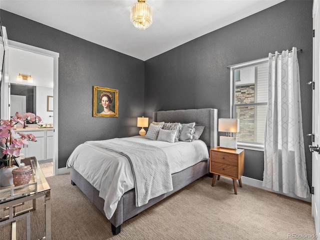 bedroom with carpet, baseboards, and a textured wall