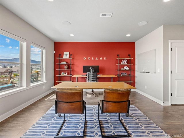 office area with visible vents, baseboards, an accent wall, wood finished floors, and recessed lighting