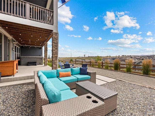 view of patio / terrace featuring a hot tub and an outdoor hangout area