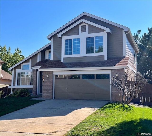 view of front facade featuring brick siding, driveway, an attached garage, and a front lawn