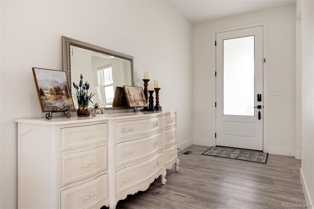 entrance foyer featuring a healthy amount of sunlight and light hardwood / wood-style flooring