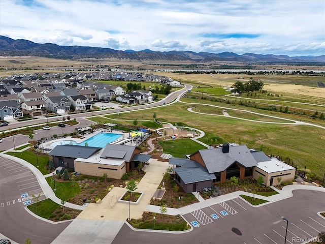 birds eye view of property with a mountain view