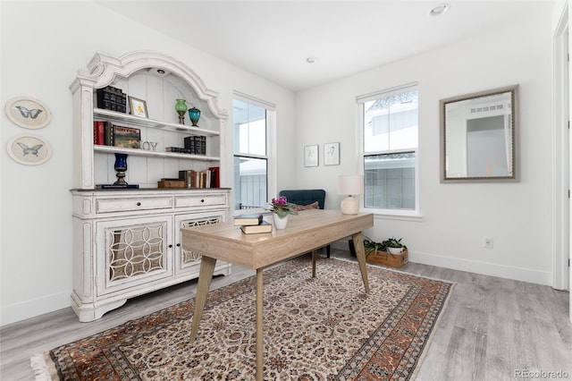 office with light hardwood / wood-style floors