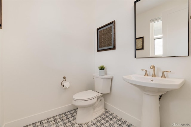 bathroom featuring tile patterned floors and toilet