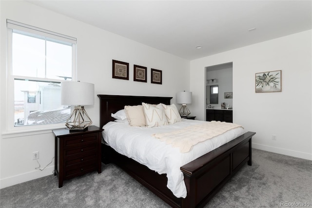 carpeted bedroom with ensuite bath