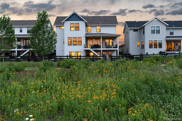 view of back house at dusk