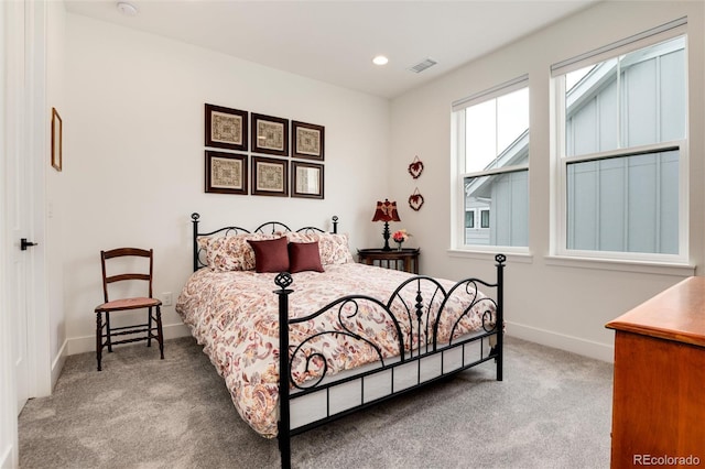 bedroom with light colored carpet