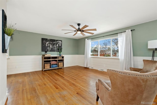 unfurnished room featuring hardwood / wood-style flooring and ceiling fan