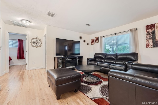 living room with light hardwood / wood-style flooring