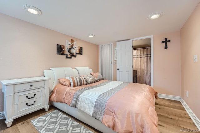 bedroom with light hardwood / wood-style floors