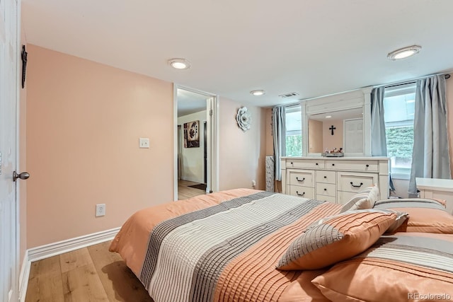 bedroom with light wood-type flooring