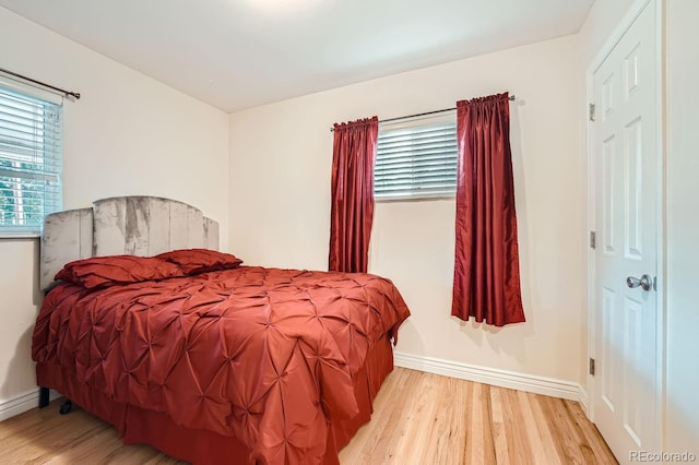 bedroom with light hardwood / wood-style flooring