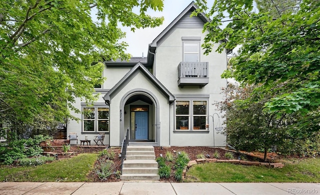 8276 E 28th Dr, Denver, CO 80238 - english style home featuring stucco siding and a balcony