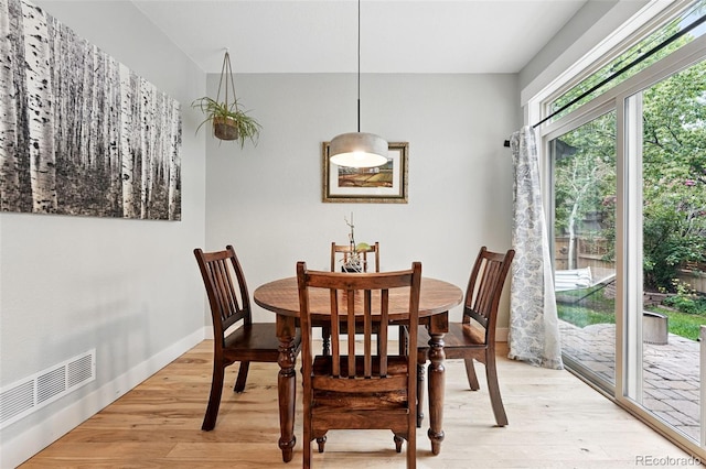 8276 E 28th Dr, Denver, CO 80238 - dining space with light wood-style floors