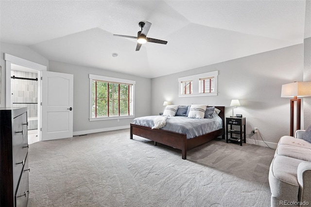 8276 E 28th Dr, Denver, CO 80238 - bedroom with carpet floors, lofted ceiling, baseboards, and a ceiling fan