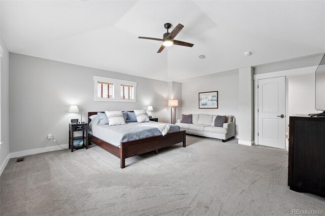 8276 E 28th Dr, Denver, CO 80238 - bedroom with baseboards, carpet flooring, lofted ceiling, and a ceiling fan