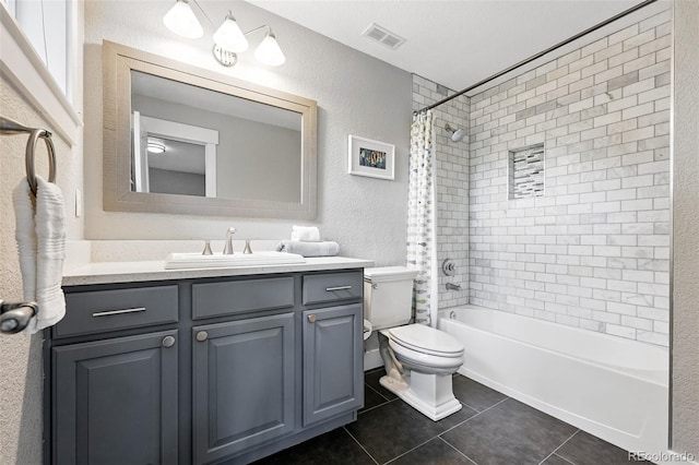 8276 E 28th Dr, Denver, CO 80238 - bathroom with vanity, toilet, tile patterned flooring, shower / tub combo with curtain, and a textured wall