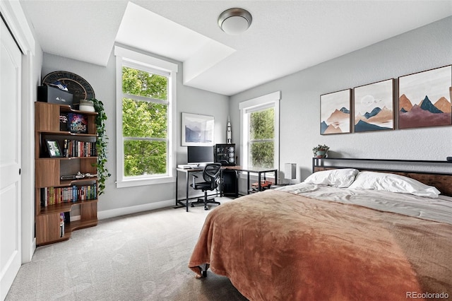 8276 E 28th Dr, Denver, CO 80238 - carpeted bedroom featuring baseboards and a desk