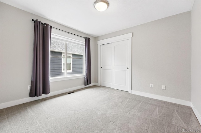 8276 E 28th Dr, Denver, CO 80238 - unfurnished bedroom with carpet, baseboards, and a closet
