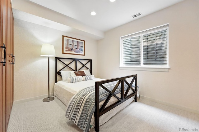 8276 E 28th Dr, Denver, CO 80238 - bedroom with light colored carpet, baseboards, and recessed lighting