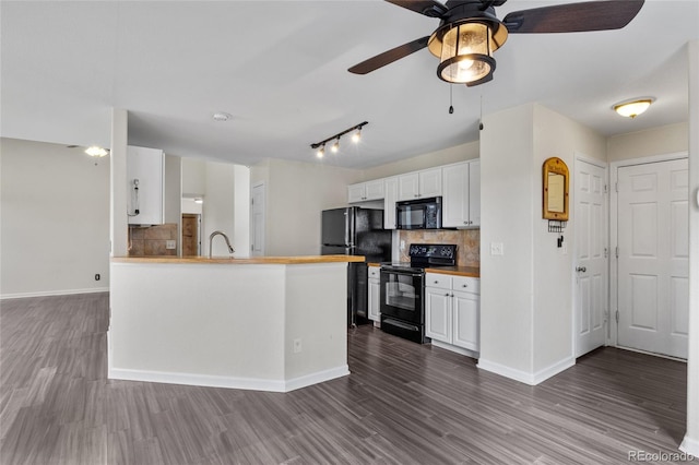 kitchen featuring black appliances, decorative backsplash, ceiling fan, and dark wood-style floors