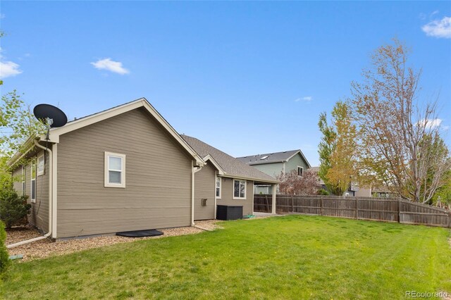 rear view of property featuring central AC unit