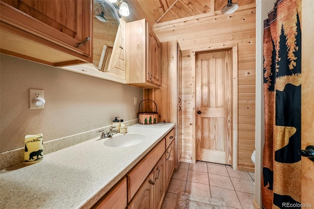 bathroom featuring vanity, wood walls, toilet, and wood ceiling