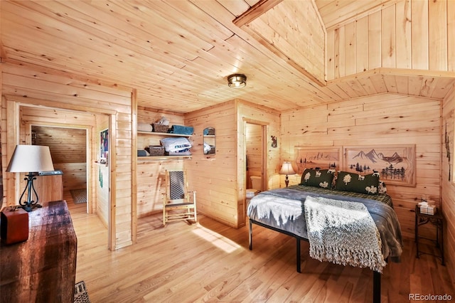 bedroom featuring wood walls, wood ceiling, vaulted ceiling, and light wood-type flooring