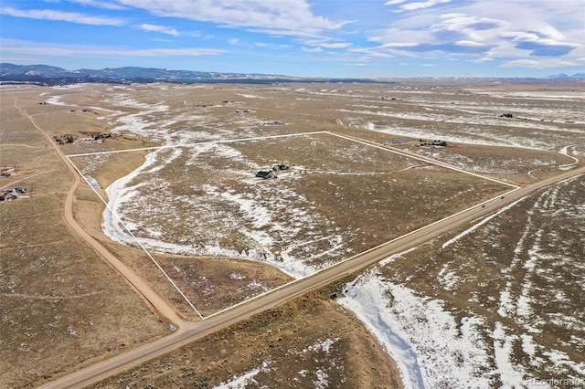 drone / aerial view featuring a mountain view