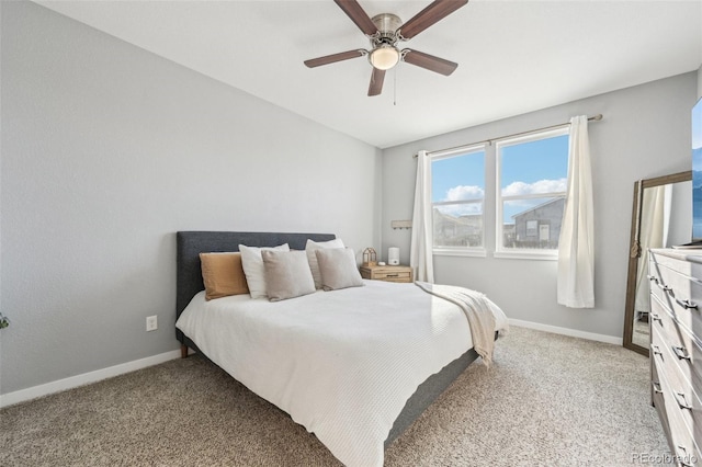 bedroom featuring ceiling fan and carpet