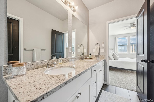 bathroom featuring tile patterned flooring, ceiling fan, and vanity