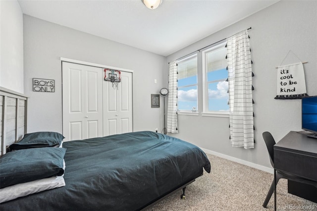 carpeted bedroom featuring a closet