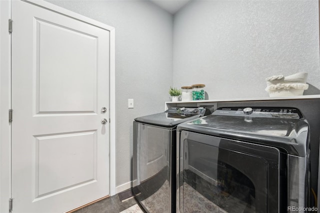 laundry room featuring separate washer and dryer