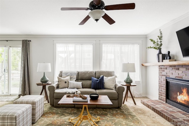 6385 S Nelson Way, Littleton, CO 80127 - living area featuring a fireplace, a ceiling fan, and crown molding
