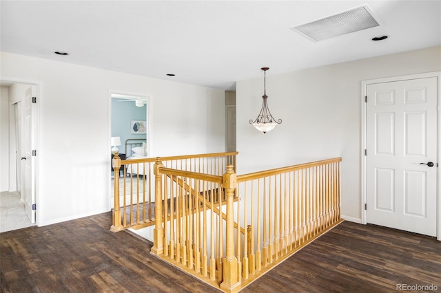 6385 S Nelson Way, Littleton, CO 80127 - hallway with an upstairs landing and wood finished floors