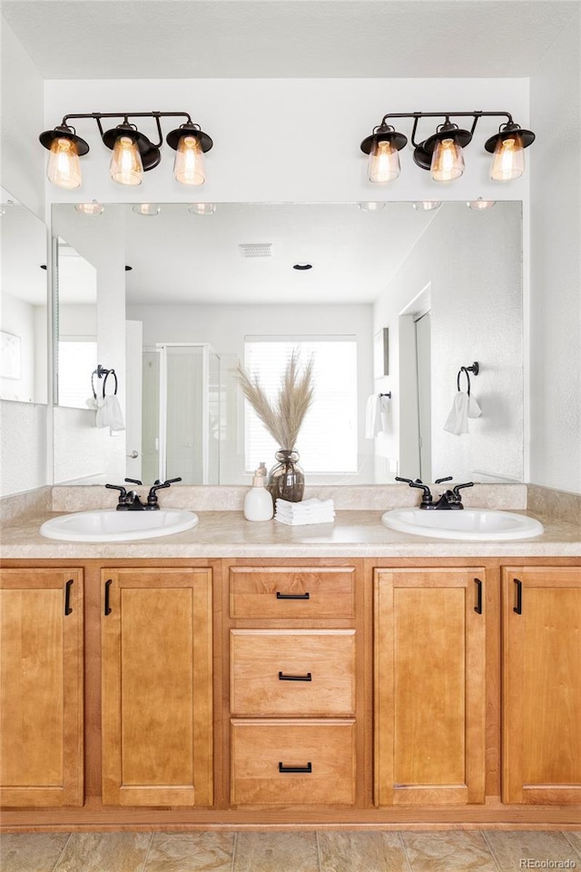 6385 S Nelson Way, Littleton, CO 80127 - bathroom with double vanity and a shower stall