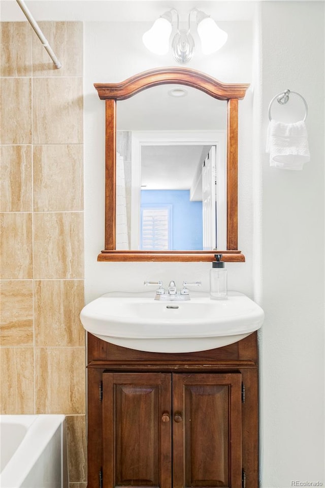 6385 S Nelson Way, Littleton, CO 80127 - full bathroom featuring vanity and bathtub / shower combination