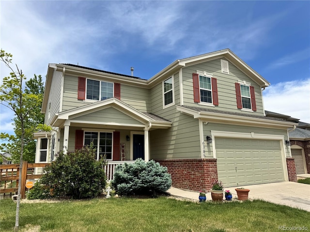 6385 S Nelson Way, Littleton, CO 80127 - traditional-style house with brick siding, a garage, driveway, and covered porch