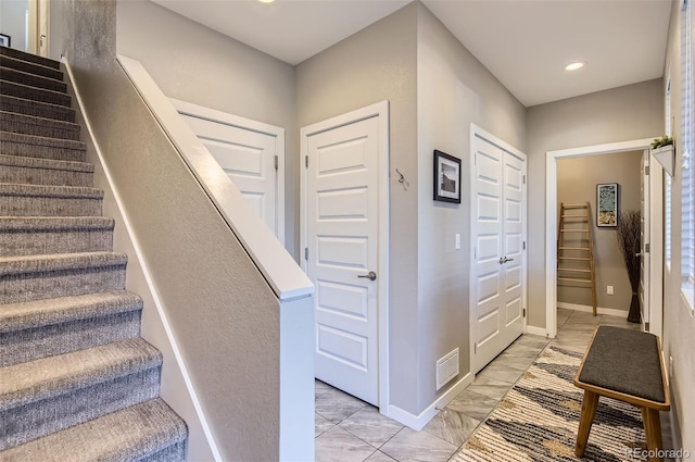 3795 Depew St Unit D, Wheat Ridge, CO 80212 - stairs with marble look tile flooring and recessed lighting