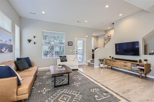 3795 Depew St Unit D, Wheat Ridge, CO 80212 - living area with wood finished floors, stairway, and recessed lighting