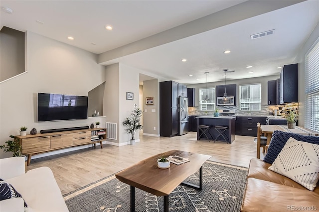 3795 Depew St Unit D, Wheat Ridge, CO 80212 - living room with light wood-style flooring and recessed lighting