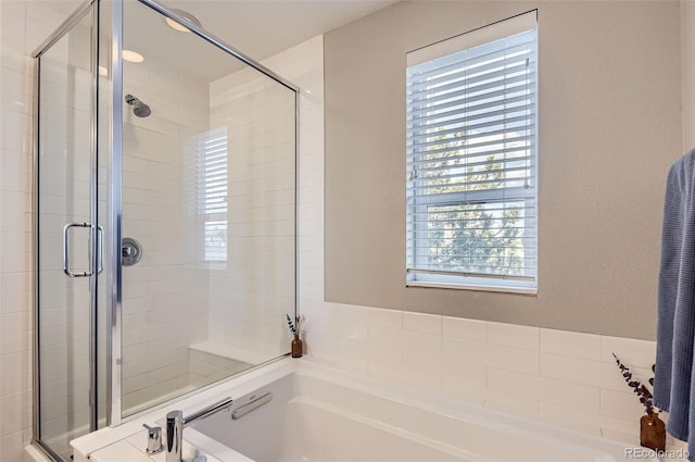 3795 Depew St Unit D, Wheat Ridge, CO 80212 - full bath featuring a shower stall, a garden tub, and plenty of natural light